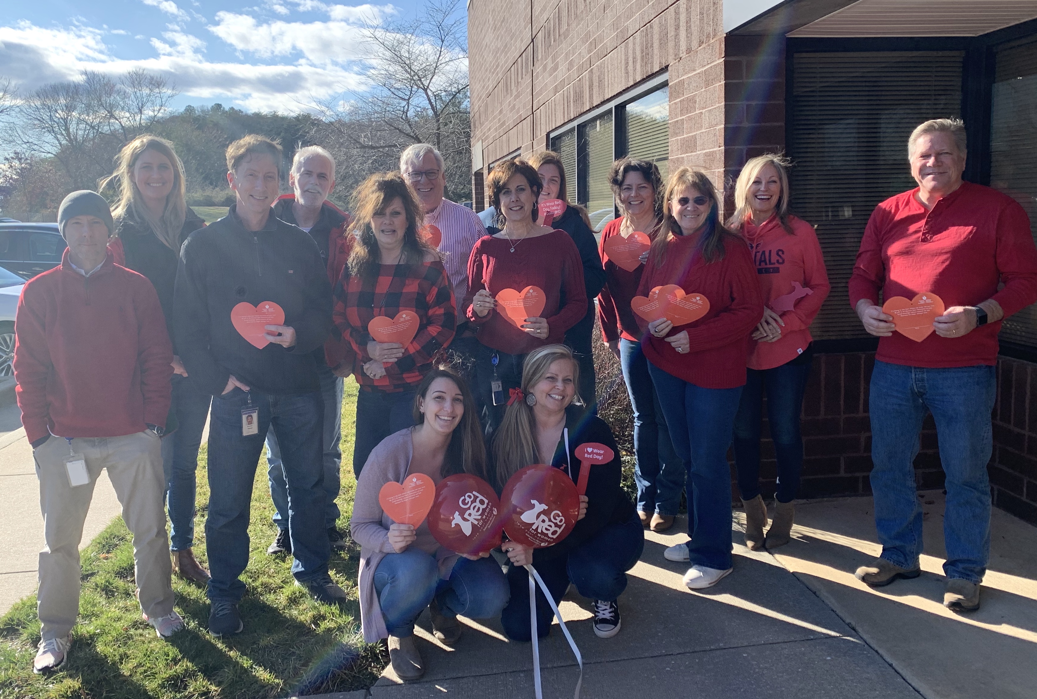 group of employees celebrating AHA heart month