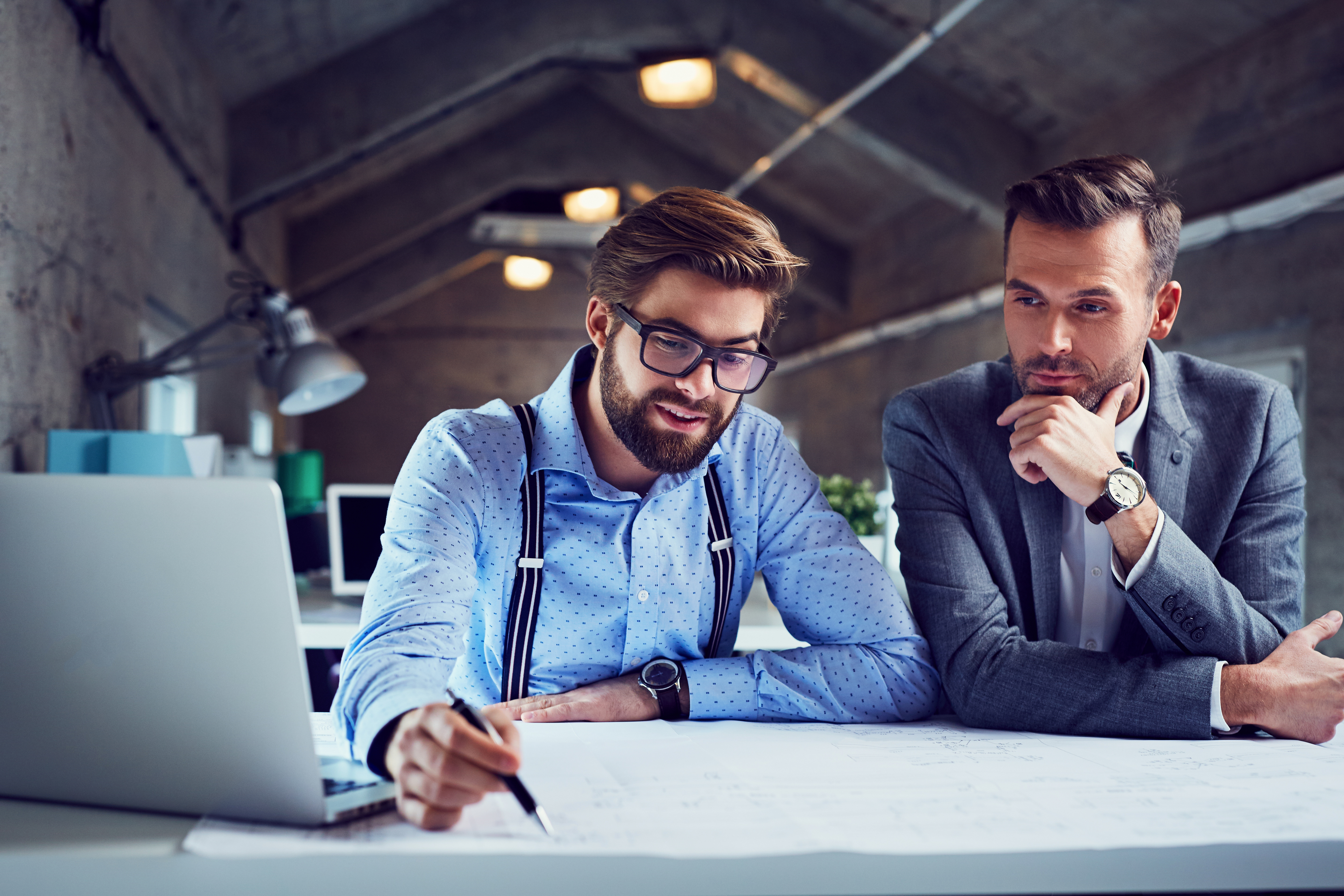 Photo of employees planning on a table