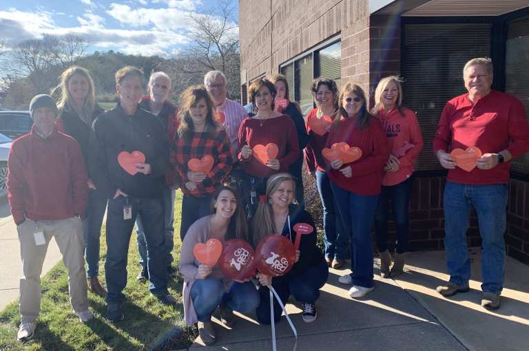 group of employees celebrating AHA heart month