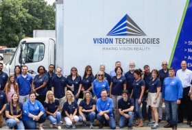 Vision employees in front of Vision Technologies truck