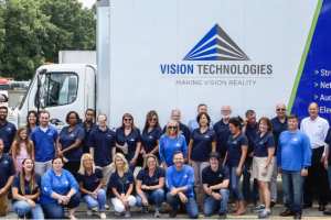 Vision employees in front of Vision Technologies truck